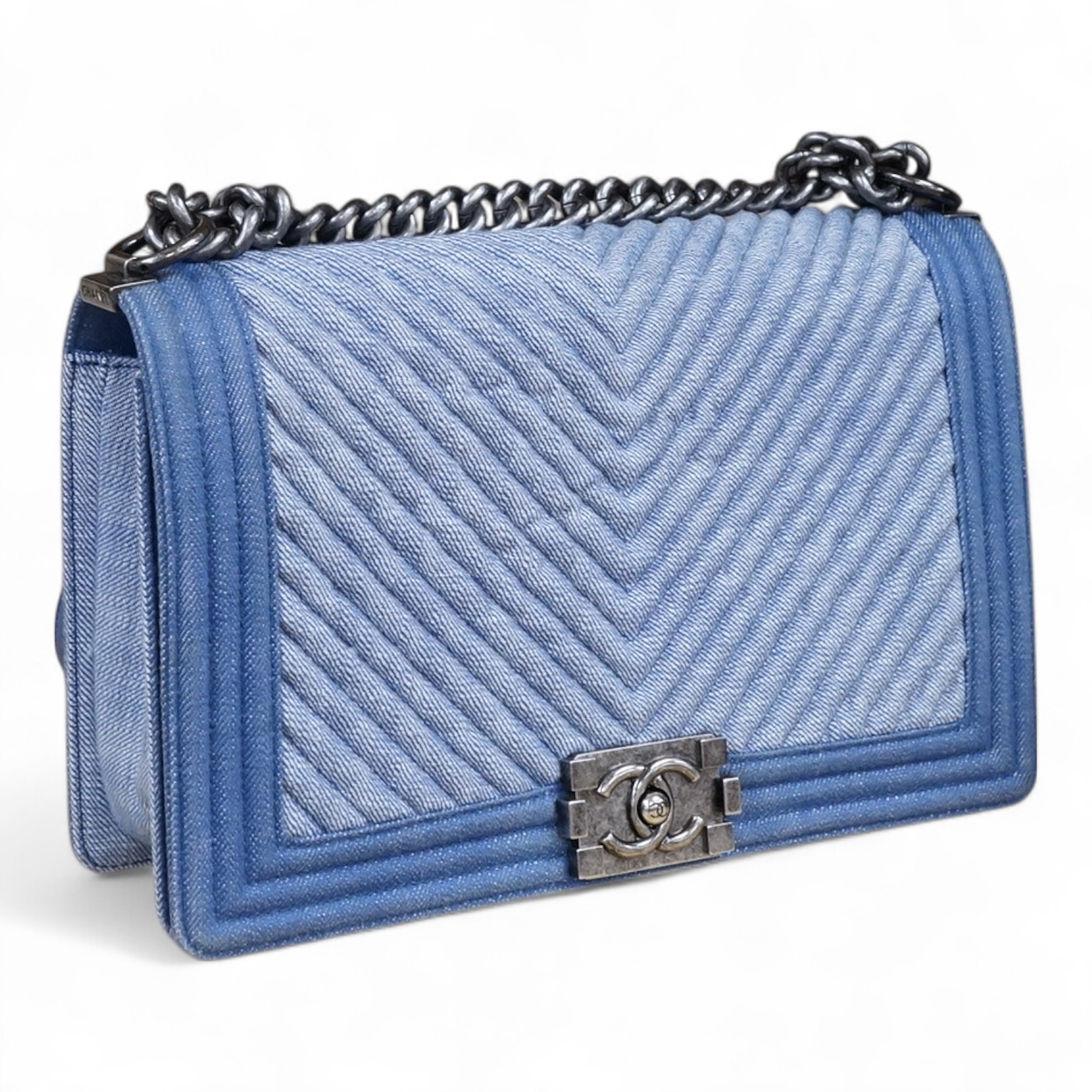 A Chanel denim cheveron flap shoulder bag with silver hardware, date code 20845697, 28cm wide